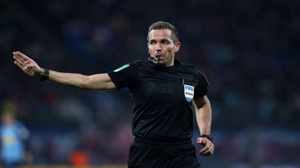 Referee blows whistle